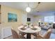 Charming dining area featuring a modern table and adjacent living space at 1303 Darlene Way # 105C, Boulder City, NV 89005