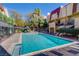 Community pool surrounded by well-maintained landscaping and townhomes at 1303 Darlene Way # 105C, Boulder City, NV 89005