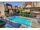 Inviting community pool, with views of adjacent townhomes and lush greenery at 1303 Darlene Way # 105C, Boulder City, NV 89005