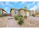 Single-story home with a two-car garage and landscaped front yard at 2261 Cold Canyon Ave, North Las Vegas, NV 89086