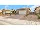 Single-story home with a two-car garage and landscaped front yard at 2261 Cold Canyon Ave, North Las Vegas, NV 89086