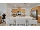 Modern kitchen with light wood cabinets, a large island, and stainless steel appliances at 2261 Cold Canyon Ave, North Las Vegas, NV 89086
