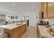 Modern kitchen with island, stainless steel appliances, and white countertops at 2261 Cold Canyon Ave, North Las Vegas, NV 89086