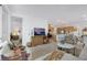 Open concept living room, kitchen, and dining area with modern finishes at 2261 Cold Canyon Ave, North Las Vegas, NV 89086