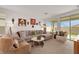 Open and airy living room with ample natural light and comfortable seating at 2261 Cold Canyon Ave, North Las Vegas, NV 89086
