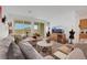 Spacious living room featuring a comfortable seating area and large windows at 2261 Cold Canyon Ave, North Las Vegas, NV 89086
