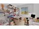 Home office with desk, chair, and metal shelving at 2261 Cold Canyon Ave, North Las Vegas, NV 89086