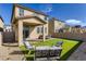 Landscaped backyard with putting green and patio at 2417 Fasano St, Henderson, NV 89044