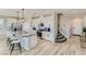 Open concept kitchen with granite island and white cabinets at 2417 Fasano St, Henderson, NV 89044
