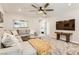 Relaxing living area featuring a sectional sofa and large TV at 2417 Fasano St, Henderson, NV 89044