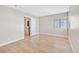 Bedroom featuring wood floors, a window, and neutral paint at 3017 Pelican Beach Dr, Las Vegas, NV 89117