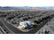 Monochromatic aerial view accentuates the modern architecture of this home and well-manicured landscape in the community at 3372 Dalmore St, Henderson, NV 89044
