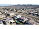 Gorgeous aerial view highlights this property, its pool, and lush backyard within a vibrant residential area at 3372 Dalmore St, Henderson, NV 89044