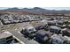 Wide aerial view of a Primary planned community with mountain views in the background at 3372 Dalmore St, Henderson, NV 89044