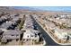 Expansive aerial view showcases this residence within its vibrant neighborhood and distant mountain backdrop at 3372 Dalmore St, Henderson, NV 89044