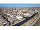 Scenic aerial view displays this home nestled in a residential community with city skyline and mountains afar at 3372 Dalmore St, Henderson, NV 89044