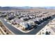 Stunning aerial shot captures this property in a picturesque neighborhood with views of mountains in the background at 3372 Dalmore St, Henderson, NV 89044
