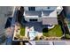 Aerial view of a backyard featuring a spa, covered patio, and well-manicured landscaping at 3372 Dalmore St, Henderson, NV 89044