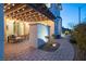 Charming backyard patio with a cozy seating area, pergola, and manicured landscaping for outdoor enjoyment at 3372 Dalmore St, Henderson, NV 89044