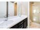 Bathroom with double sinks, shower with glass door, and modern fixtures at 3372 Dalmore St, Henderson, NV 89044