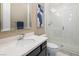Bright bathroom featuring a shower with glass door and modern fixtures at 3372 Dalmore St, Henderson, NV 89044