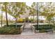 View of a community center entrance featuring stone accents, well-maintained landscaping and seating at 3372 Dalmore St, Henderson, NV 89044