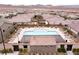Aerial view of the community pool with tiled roof structures, lounge seating, and ample space for relaxation at 3372 Dalmore St, Henderson, NV 89044