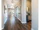 Bright hallway with wood-look tile floors, leading to an outdoor area, enhanced by recessed lighting and neutral tones at 3372 Dalmore St, Henderson, NV 89044