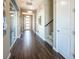 Hallway with staircase, stylish lighting, wood-look tile flooring, and access to other rooms at 3372 Dalmore St, Henderson, NV 89044