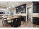 Open-concept kitchen with a large island, dark wood cabinets, and stainless steel appliances, ideal for entertaining at 3372 Dalmore St, Henderson, NV 89044