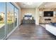 Bright and airy living room with large sliding glass doors that open to the backyard, plus a modern fireplace at 3372 Dalmore St, Henderson, NV 89044