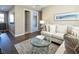An elegant living room with a comfortable sofa, modern coffee table, and ceiling fan creating a relaxing space at 3372 Dalmore St, Henderson, NV 89044