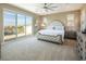 Comfortable main bedroom with large windows providing excellent natural light and a view of the balcony at 3372 Dalmore St, Henderson, NV 89044
