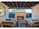 Inviting outdoor living area featuring a cozy fireplace and stylish pergola with string lights, perfect for relaxing evenings at 3372 Dalmore St, Henderson, NV 89044