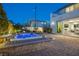 The patio features a hot tub with a view into the home through sliding glass doors and access to the backyard at 3372 Dalmore St, Henderson, NV 89044