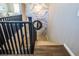 A staircase with dark wood railing accents, leading to the next level of the house at 3372 Dalmore St, Henderson, NV 89044