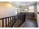 A staircase with dark wood railing accents, leading to the next level of the house at 3372 Dalmore St, Henderson, NV 89044