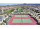 Aerial shot showcasing the community tennis courts and recreational area in a neighborhood at 3372 Dalmore St, Henderson, NV 89044