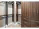 Walk-in closet with wooden built-in shelving at 3372 Dalmore St, Henderson, NV 89044