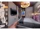 Stylish bedroom with gray walls, a modern chandelier, and ensuite bath at 3726 Las Vegas Blvd # 1101, Las Vegas, NV 89158