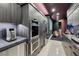 Modern kitchenette featuring stainless appliances and gray cabinetry at 3726 Las Vegas Blvd # 1101, Las Vegas, NV 89158