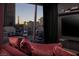 Modern living room featuring comfortable seating and a floor to ceiling window with a stunning city view at 3726 Las Vegas Blvd # 1101, Las Vegas, NV 89158