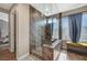 Spa-like bathroom with walk-in shower and bench at 4773 Sarazen Cir, Las Vegas, NV 89103