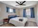 Well-lit bedroom featuring a full bed, nightstand and ceiling fan at 4773 Sarazen Cir, Las Vegas, NV 89103