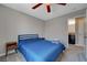 Spacious bedroom with full bed, nightstand and access to bathroom at 4773 Sarazen Cir, Las Vegas, NV 89103
