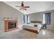 Spacious bedroom with fireplace and ensuite bathroom access at 4773 Sarazen Cir, Las Vegas, NV 89103