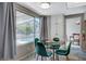 Breakfast nook with pool view and green velvet chairs at 4773 Sarazen Cir, Las Vegas, NV 89103