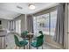 Bright breakfast nook with glass table and green chairs at 4773 Sarazen Cir, Las Vegas, NV 89103