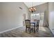 Bright dining room with chandelier and wood-look flooring at 4773 Sarazen Cir, Las Vegas, NV 89103