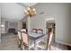 Formal dining room with chandelier and view to living room at 4773 Sarazen Cir, Las Vegas, NV 89103